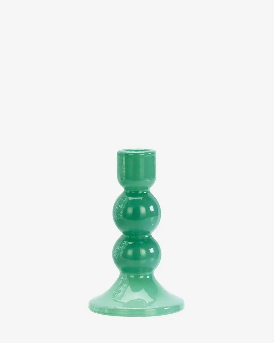 Green candle holder on a white background