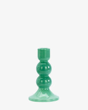Green candle holder on a white background