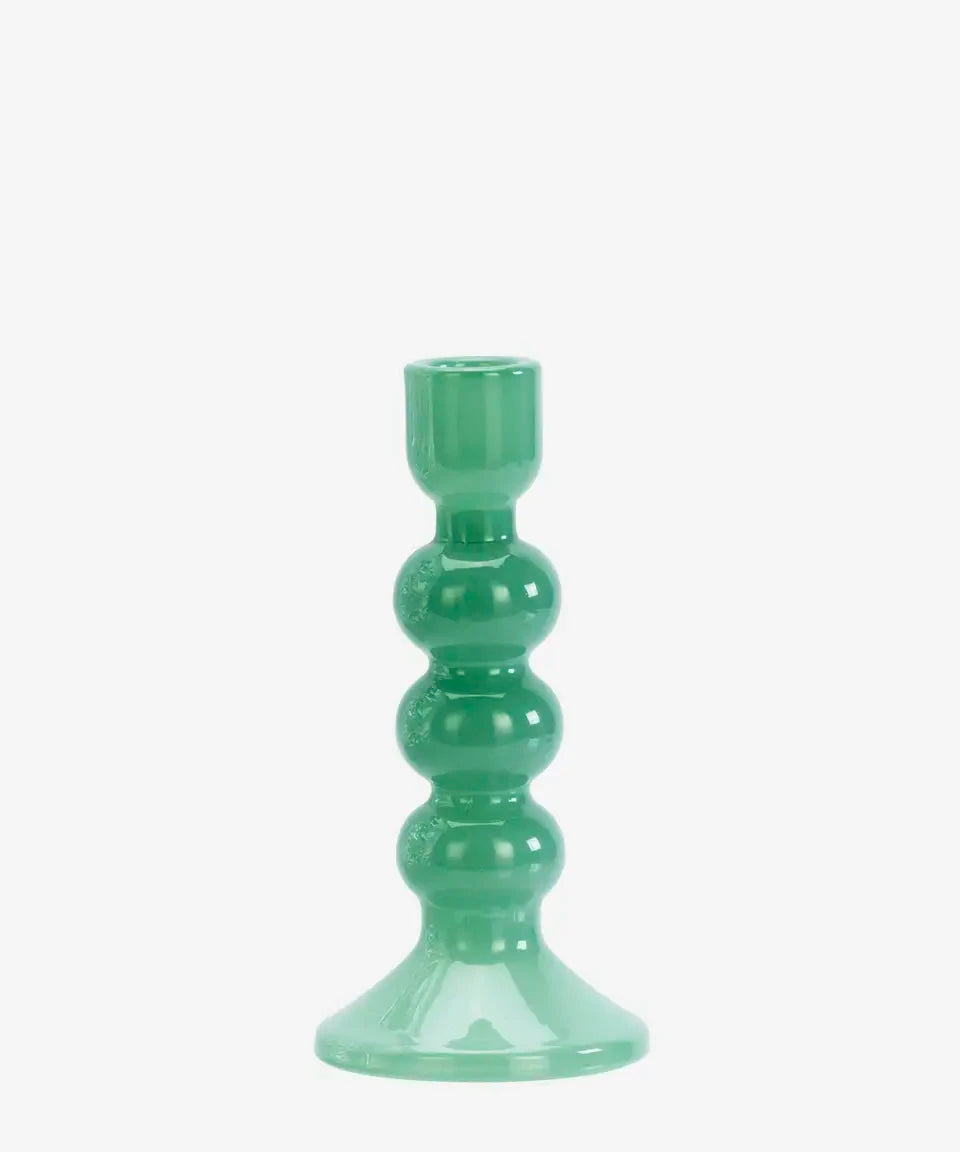 Green candle holder on a white background