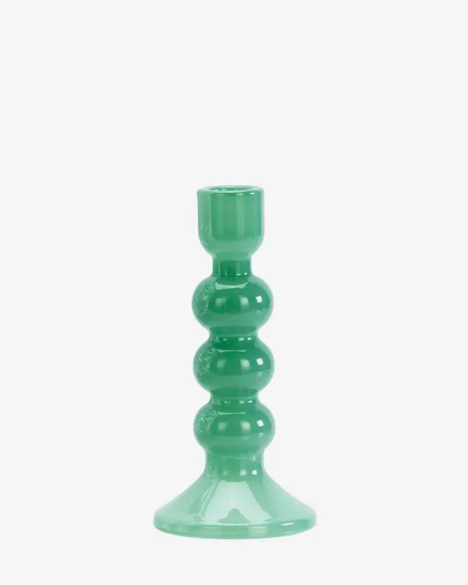 Green candle holder on a white background