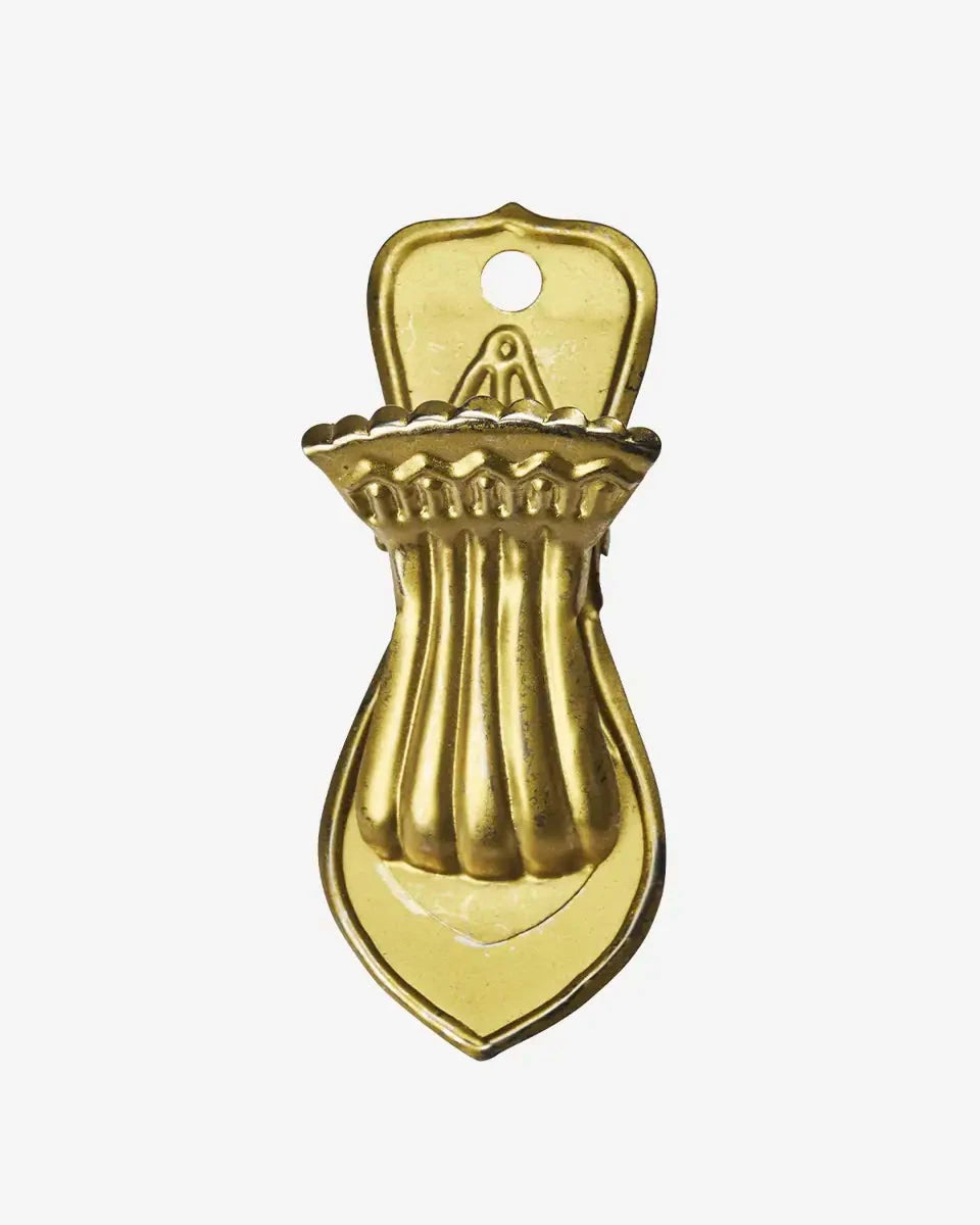 Gold bottle opener on a white background