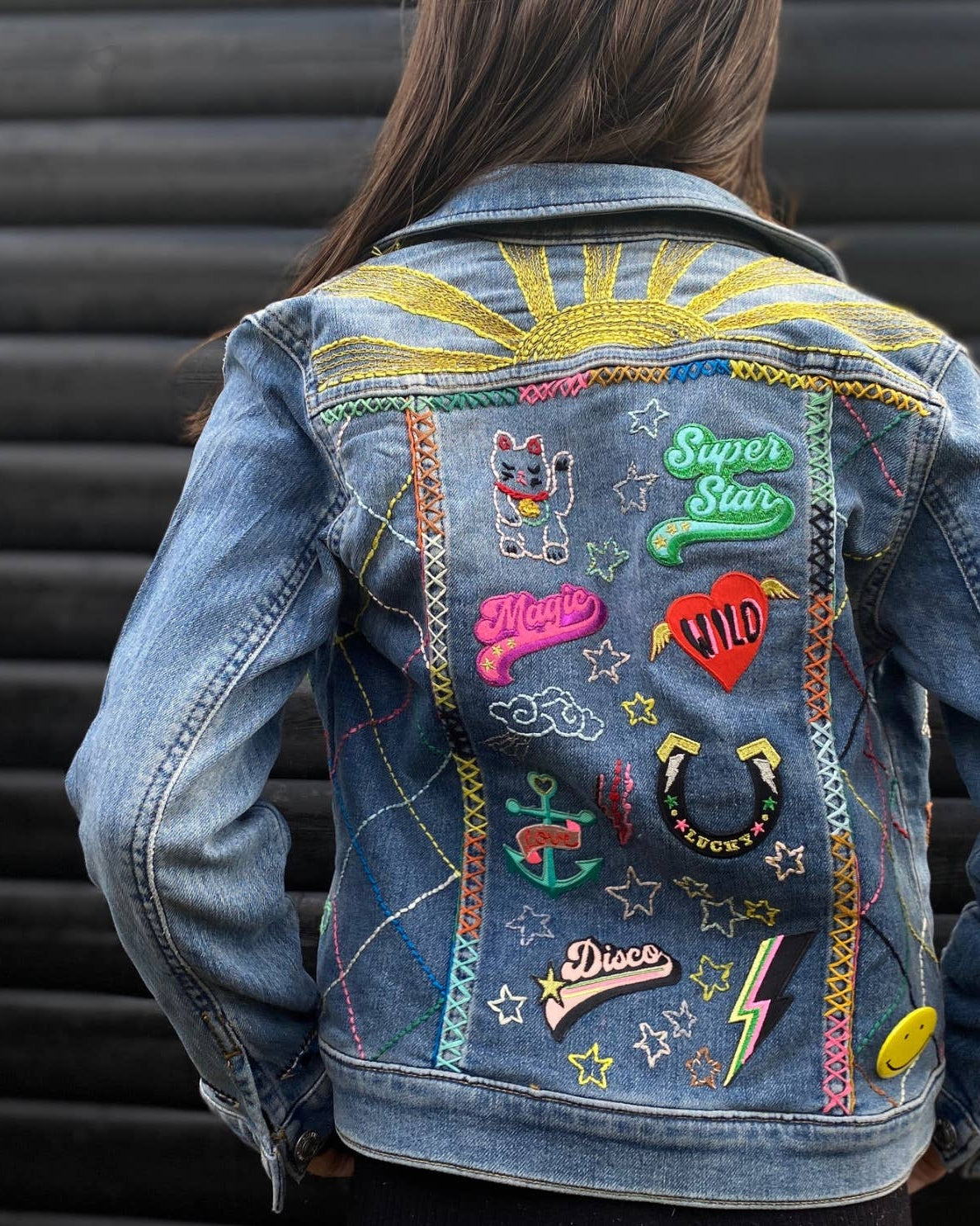 Petra Boase happy flower iron-on embroidered patch on neutral background