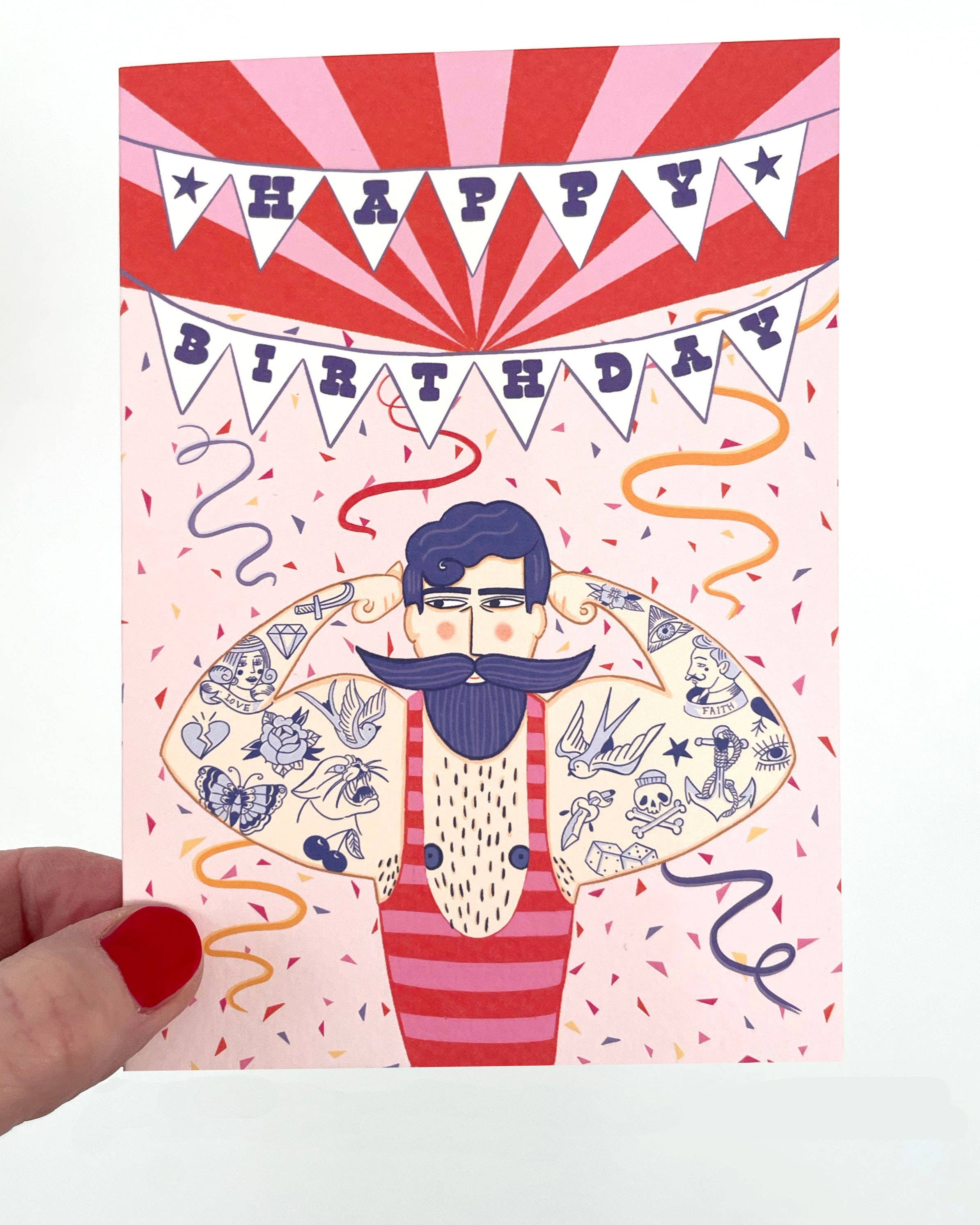Birthday card with a stylized illustration of a man with tattoos and a colorful 'Happy Birthday' banner.