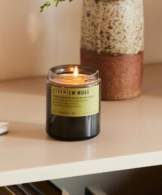 Geranium Moss 7.2 oz Soy Candle, hand-poured into apothecary-inspired amber jars with signature kraft label and a brass lid, by PF Candle Co.