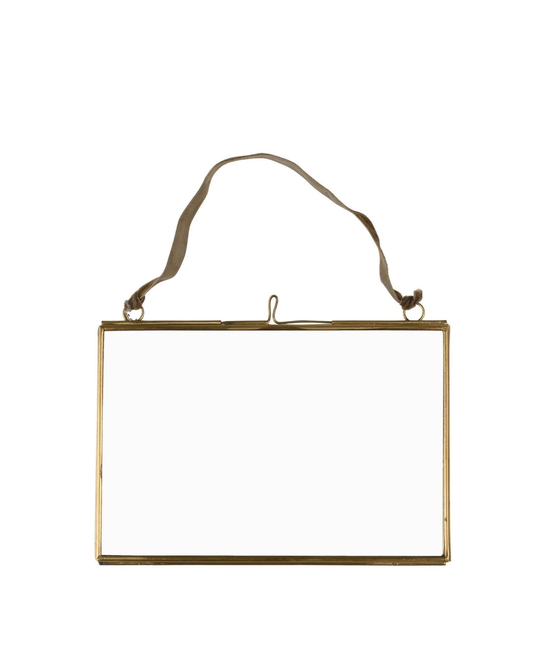 Gold rectangular frame with a string on a white background