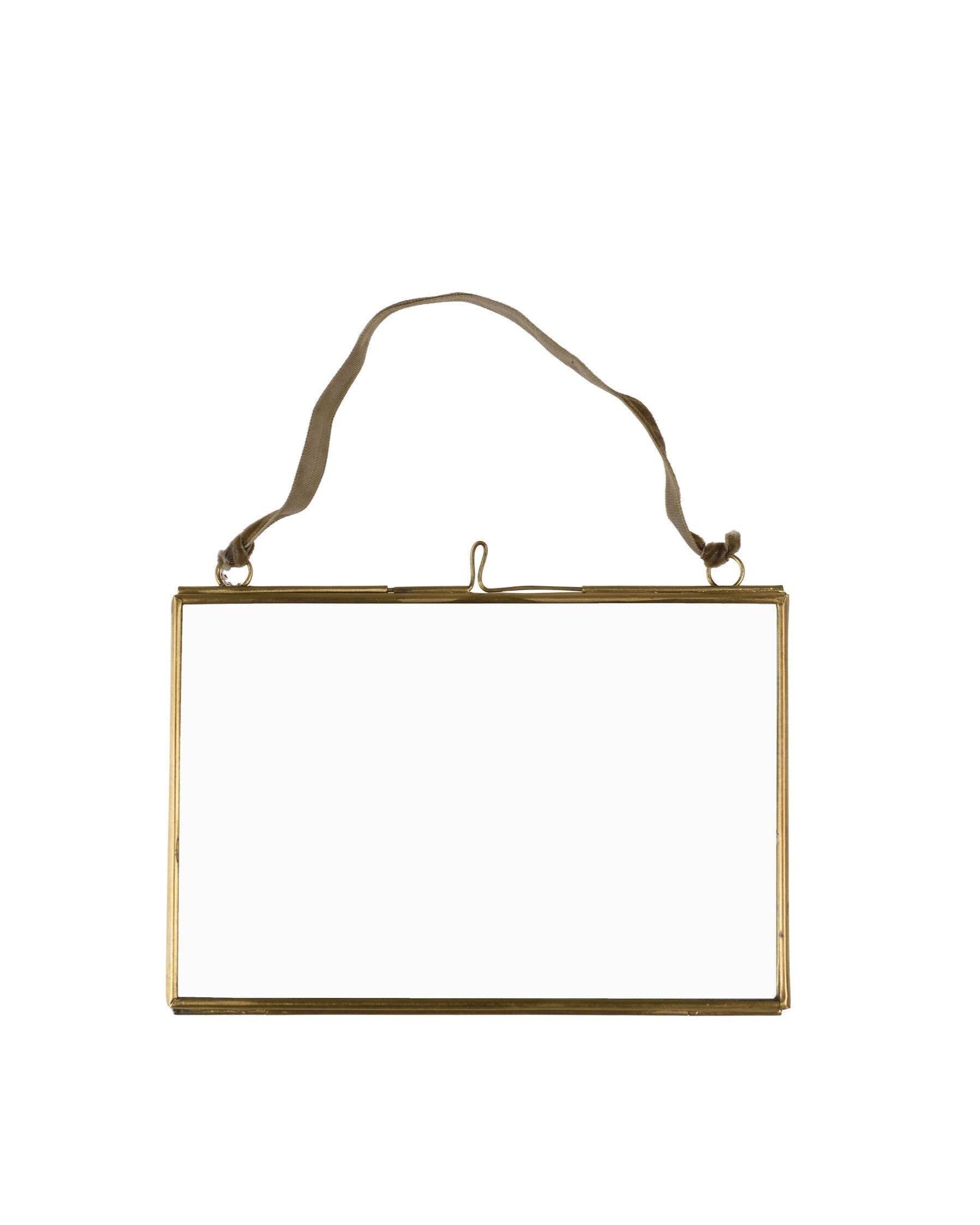 Gold rectangular frame with a string on a white background