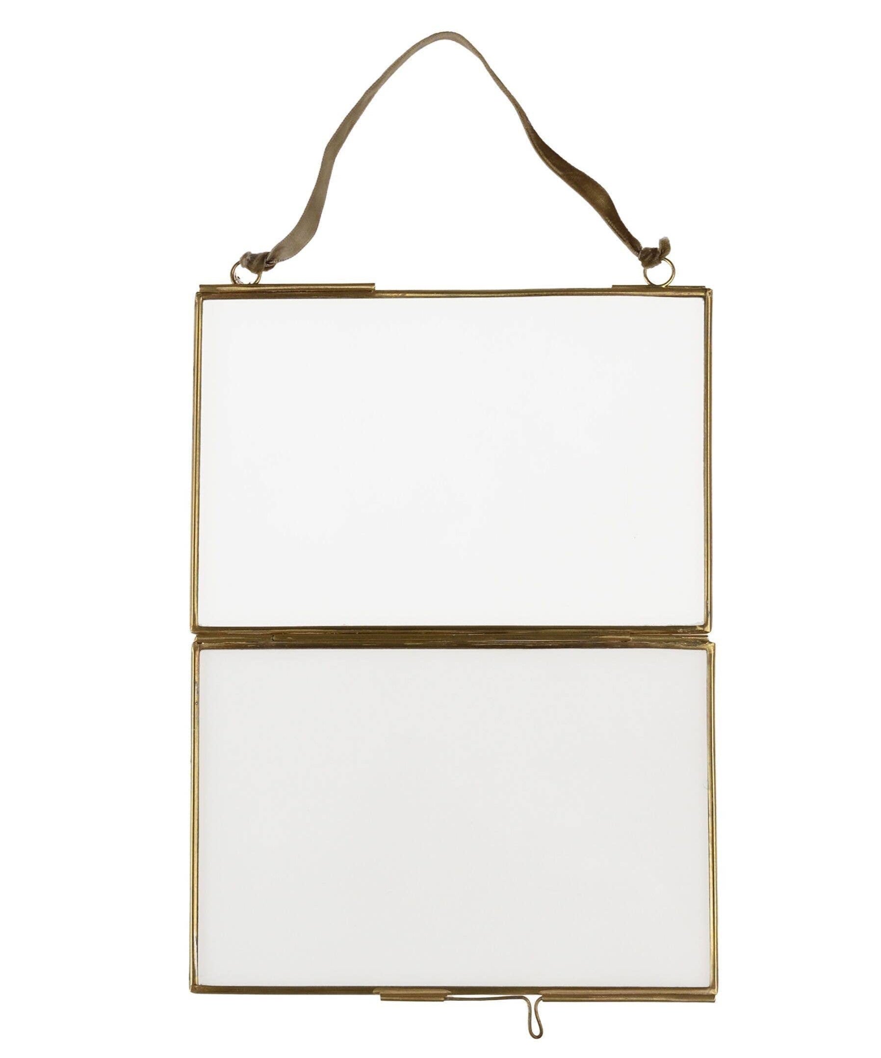 Hanging rectangular mirror with gold frame on a white background
