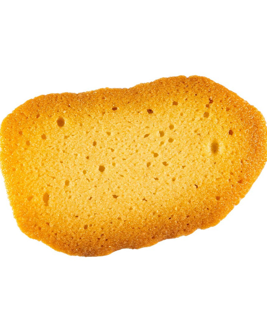 Single piece of golden brown cake on a white background