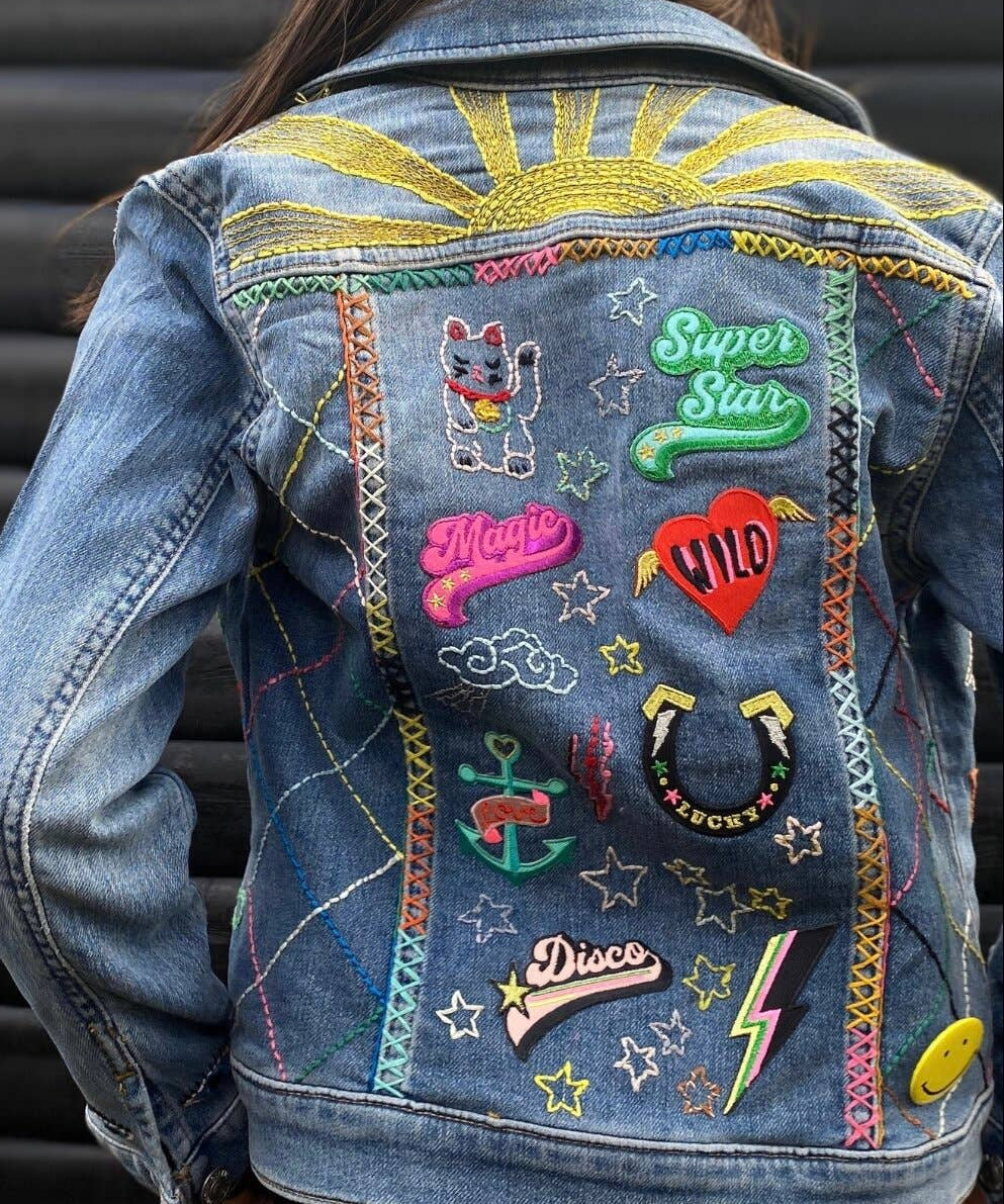 Multiple patches on a denim jacket back
