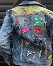 Multiple patches on a denim jacket back