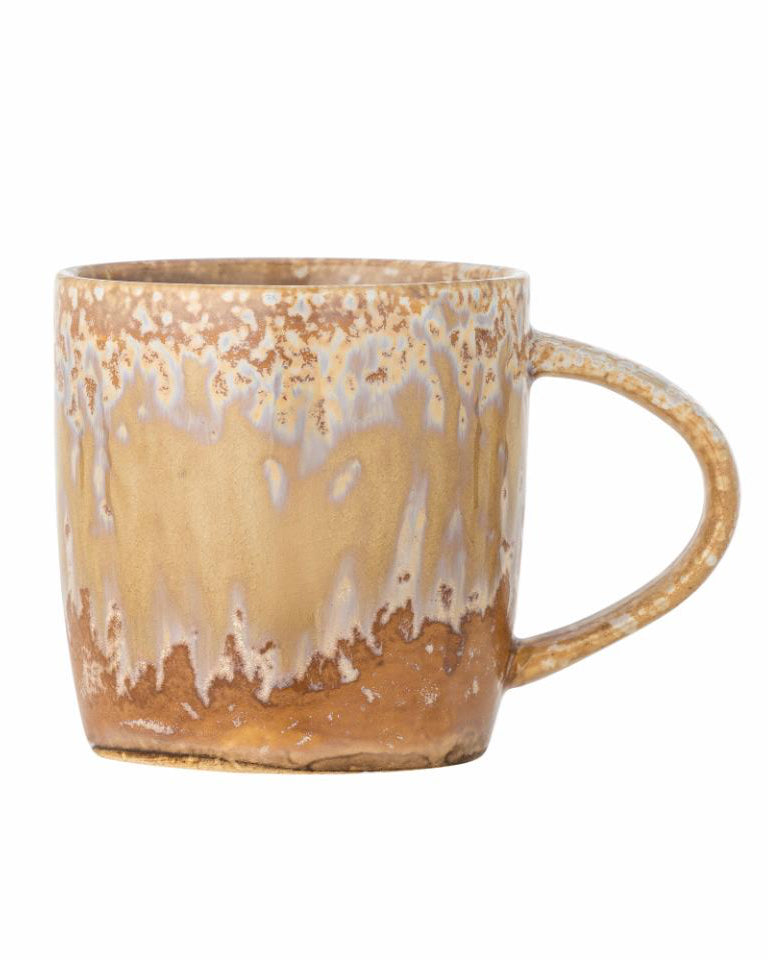 Ceramic mug with a rustic, distressed finish on a white background