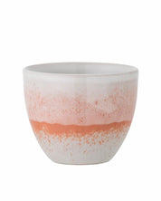 Ceramic pot with a two-tone design on a white background