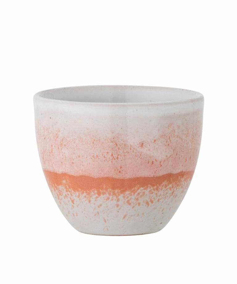 Ceramic pot with a two-tone design on a white background