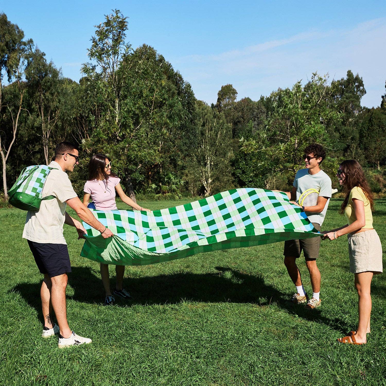 Dock & Bay picnic blanket, Apple Tart print, folded with carry pouch