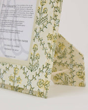 Floral-patterned paper with text on a white background
