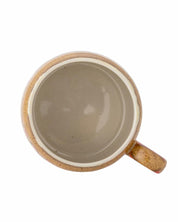 Ceramic mug with a handle on a white background