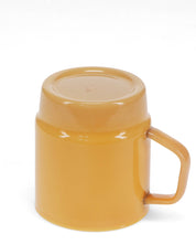 Yellow mug with a lid on a white background
