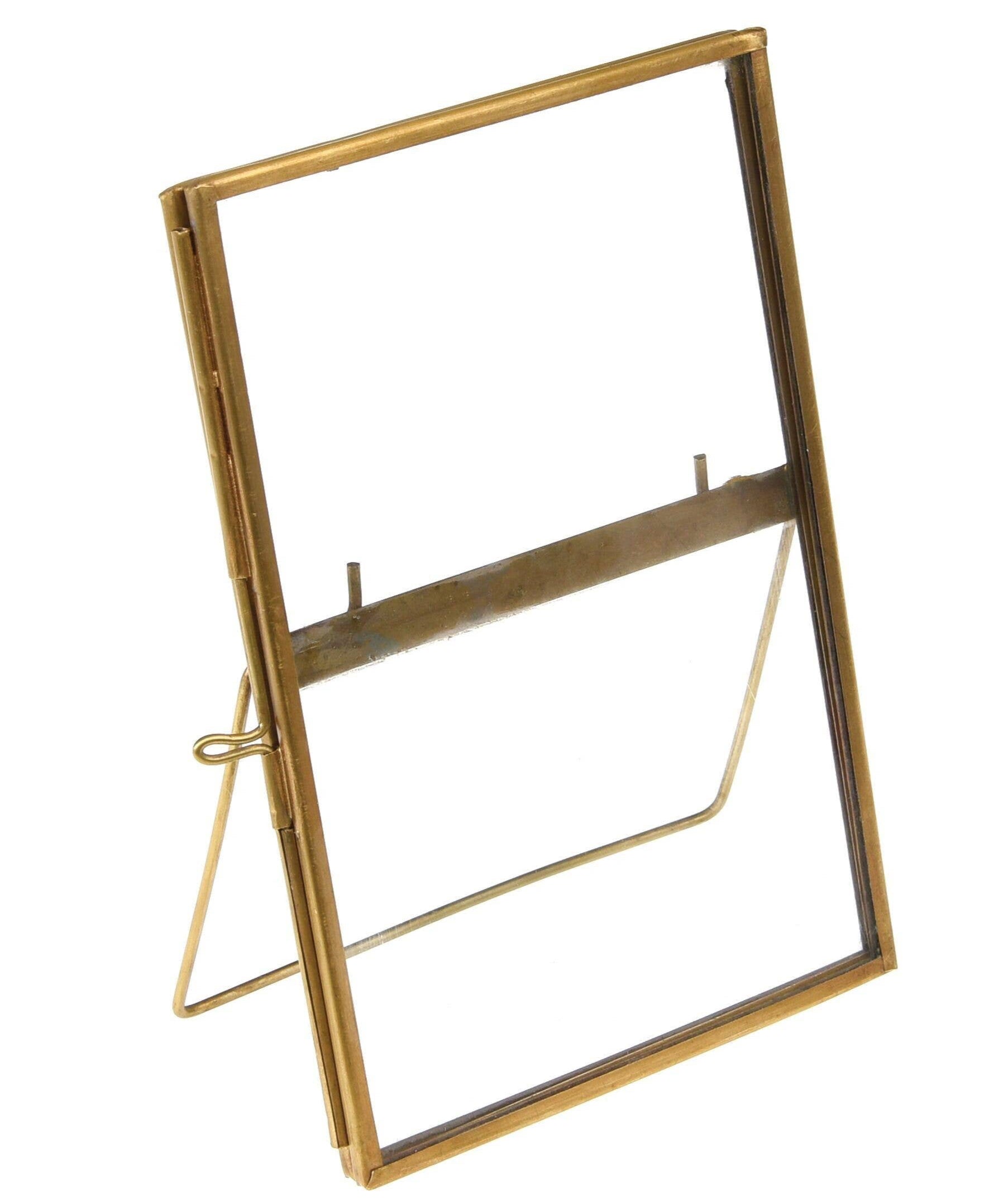 Gold-framed mirror on a white background