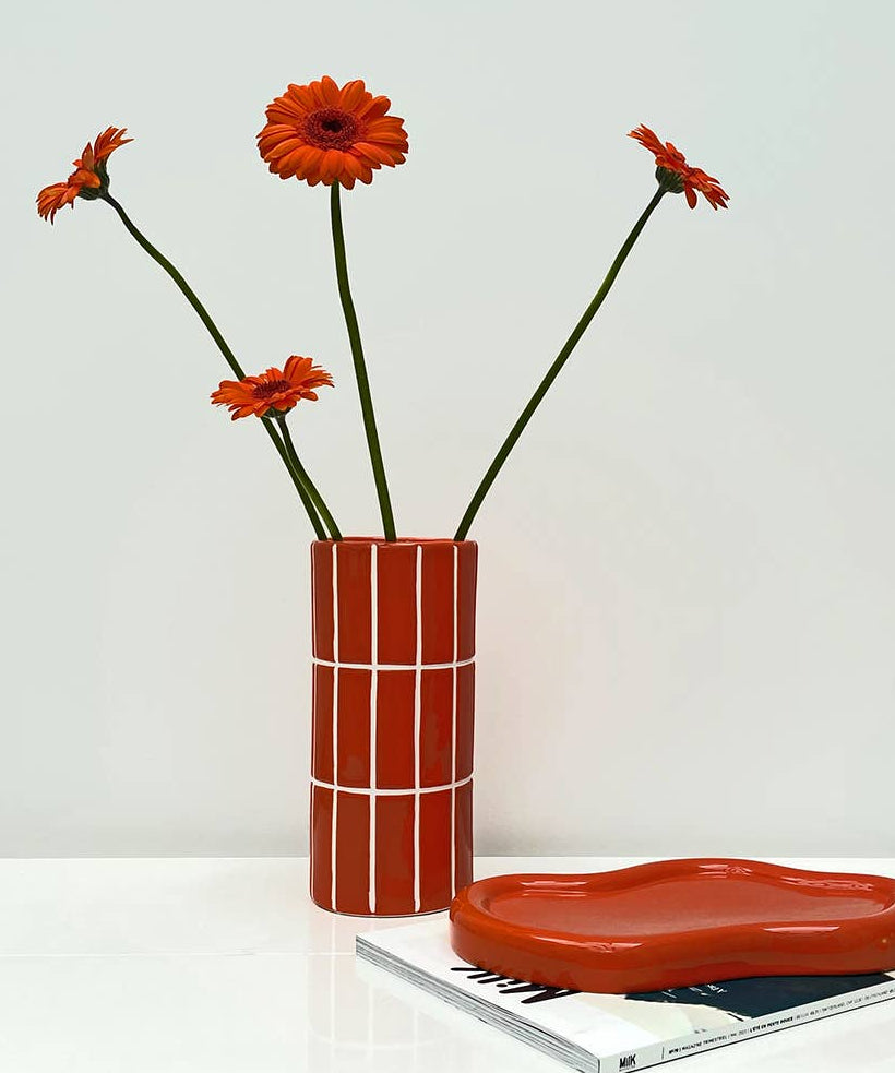Opjet Paris orange tile effect ceramic vase with flowers on a table