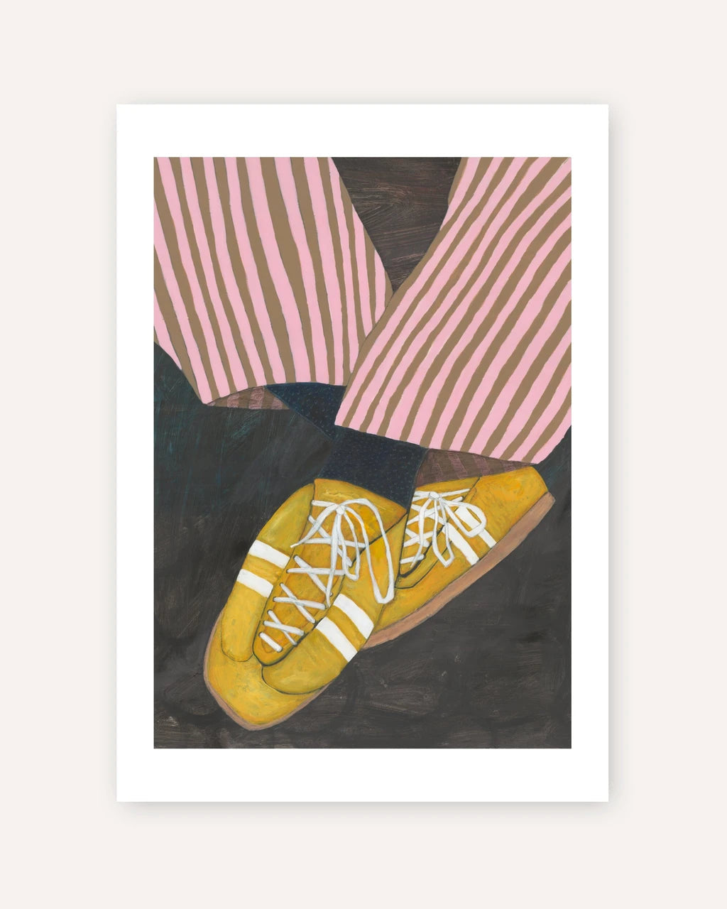 A framed art print featuring a stylized illustration of yellow sneakers with white laces, pink and brown striped trousers, and a dark background, displayed against a light beige wall.