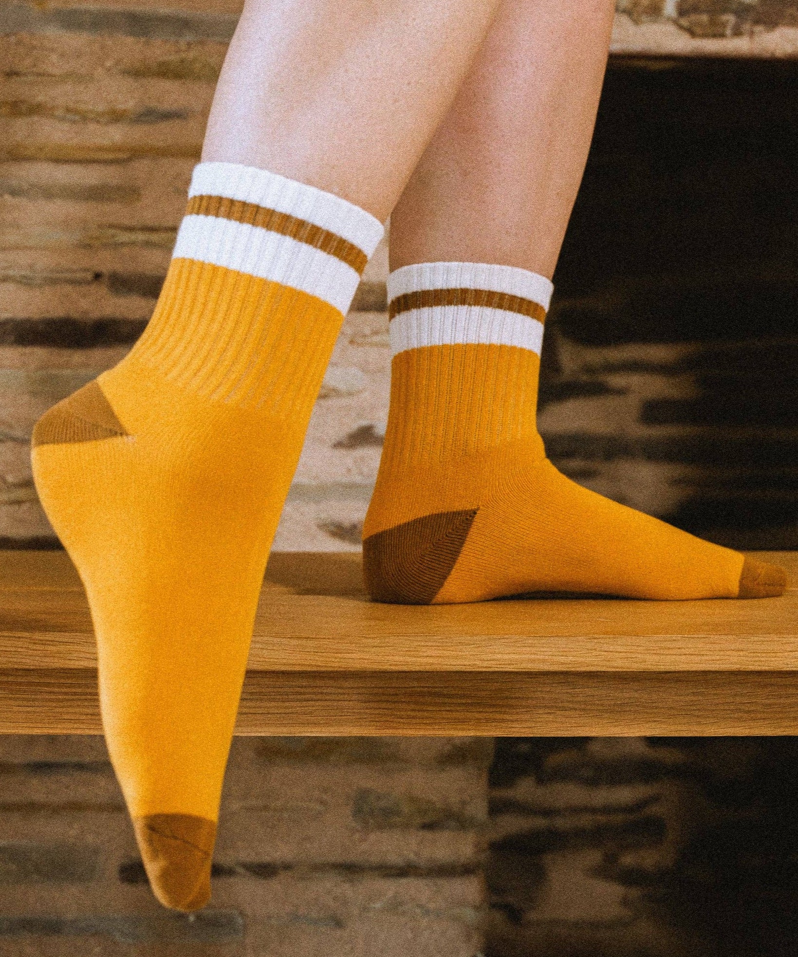 Feet wearing marigold varsity sock
