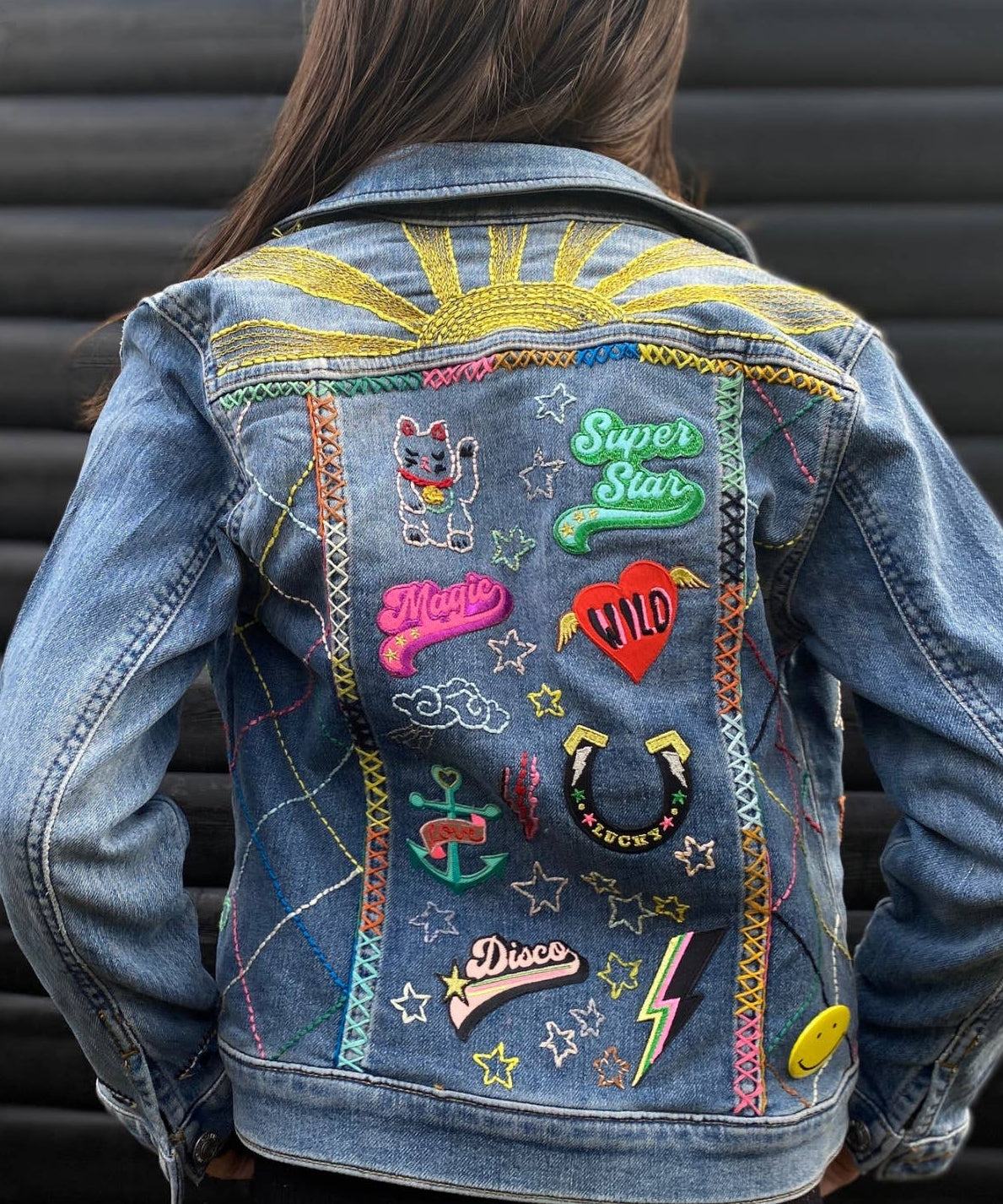 multiple patches on a denim jacket