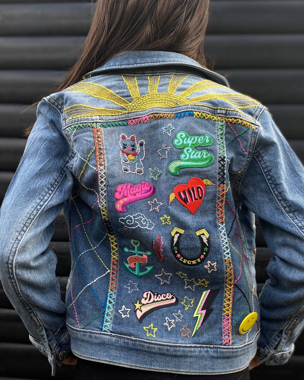 multiple patches on a denim jacket