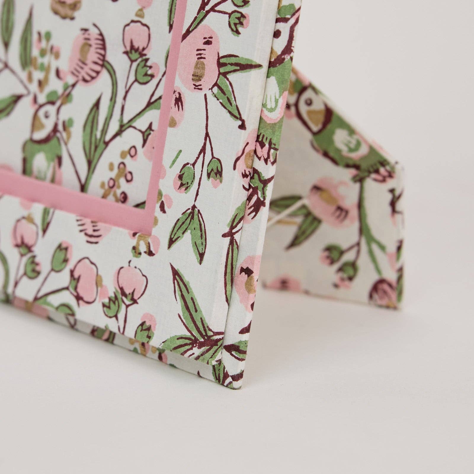 Floral patterned picture frame made from recycled cotton paper, on a white background