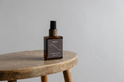 Quiet Hours Evening Ritual pillow and linen mist in amber glass bottle