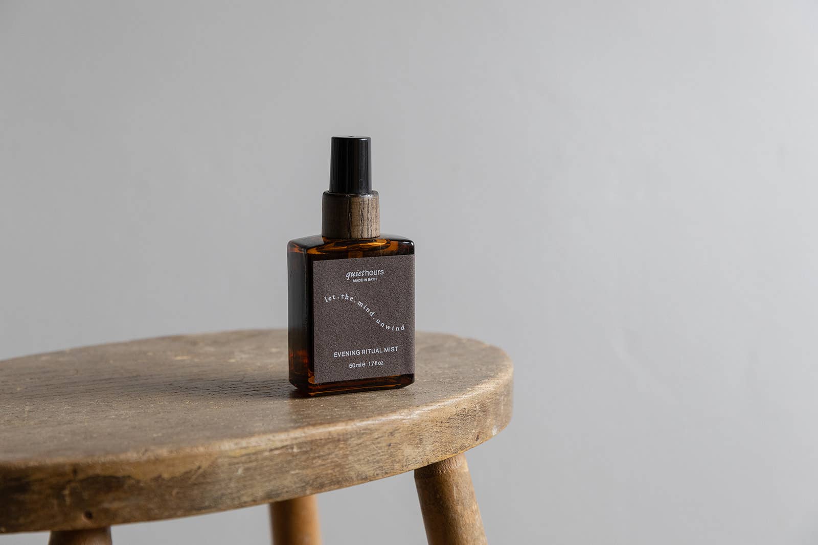 Quiet Hours Evening Ritual pillow and linen mist in amber glass bottle