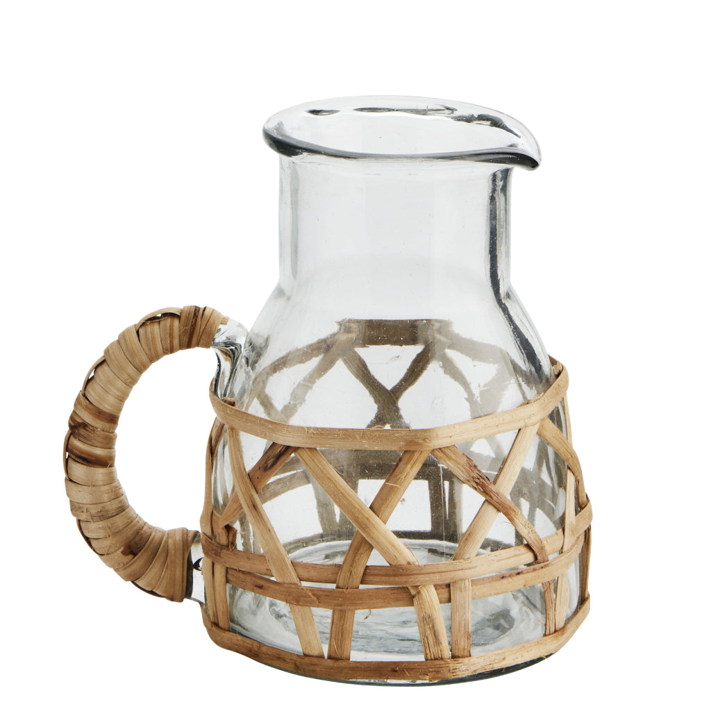 The Every Space bohemian style Glass Jug with bamboo cane surround and handle by Madam Stoltz