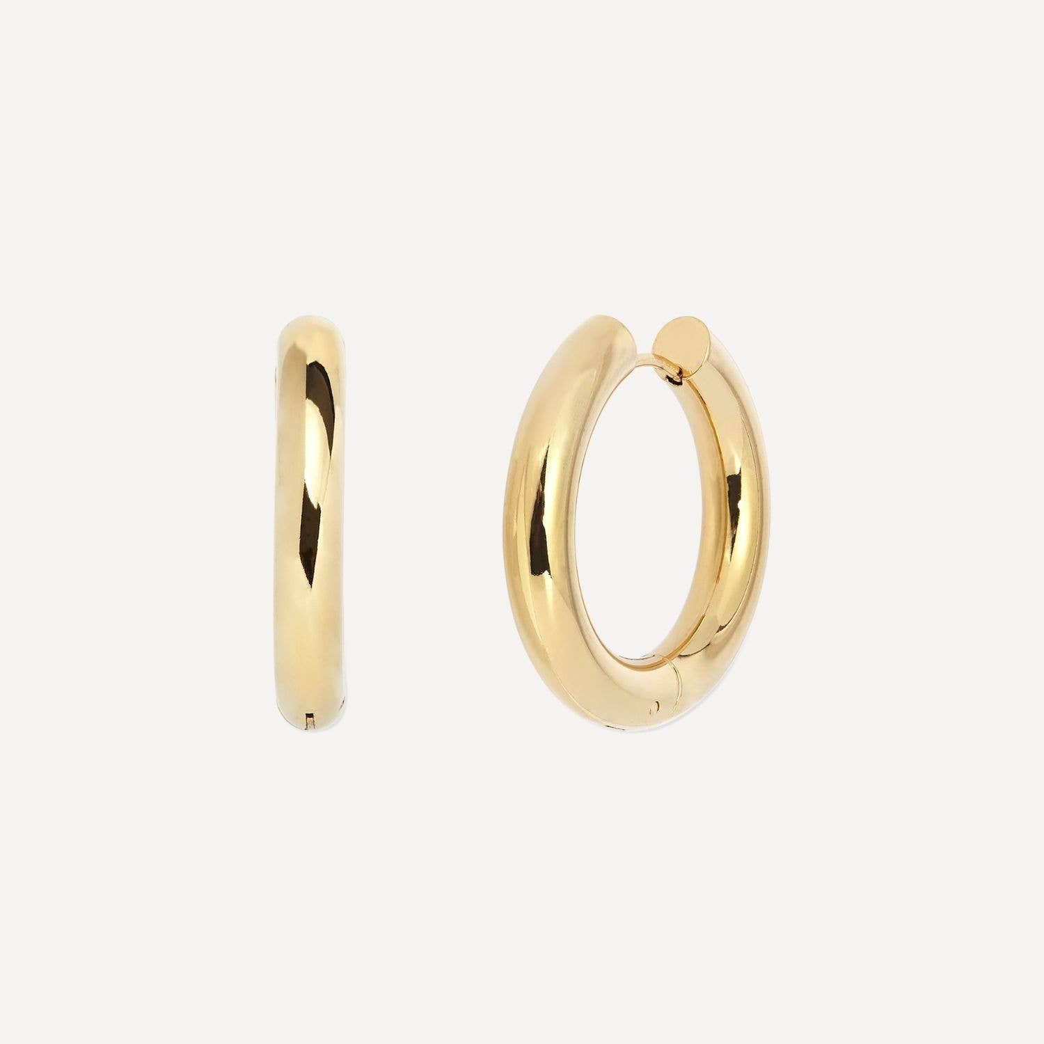 Gold hoop earrings on a white background