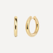 Gold hoop earrings on a white background