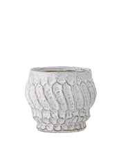The Cami Flowerpot by Bloomingville is made of stoneware in white with an abstract structure