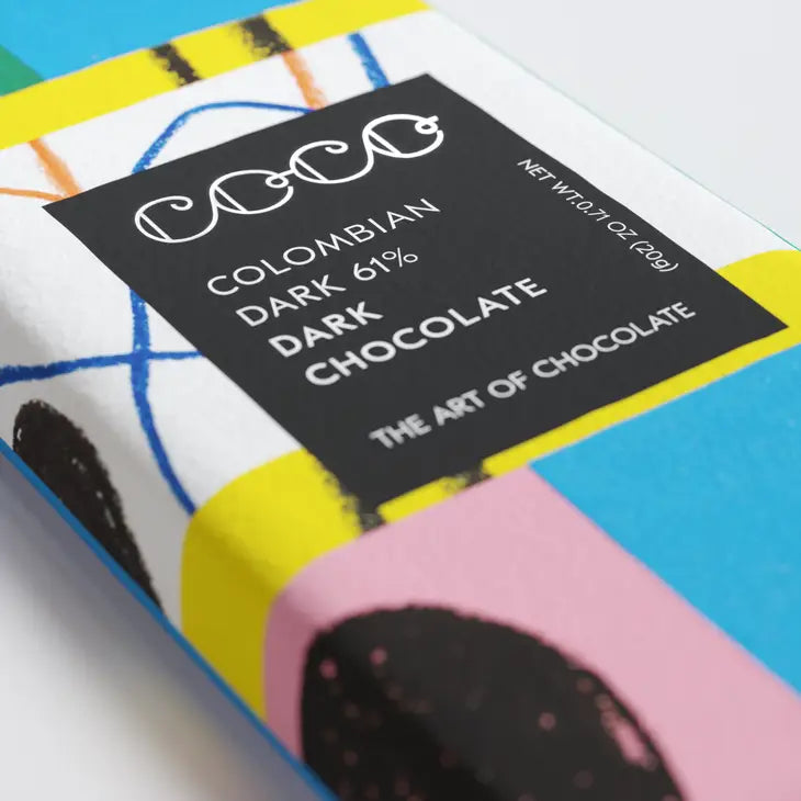 The 20g Colombian Dark 60% mini chocolate bar, by Coco Chocolatier, features artwork by&nbsp;Atelier Bingo and is vegetarian, vegan, gluten free, dairy free, and Palm Oil free