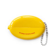 Yellow coin pouch shown open with its chain