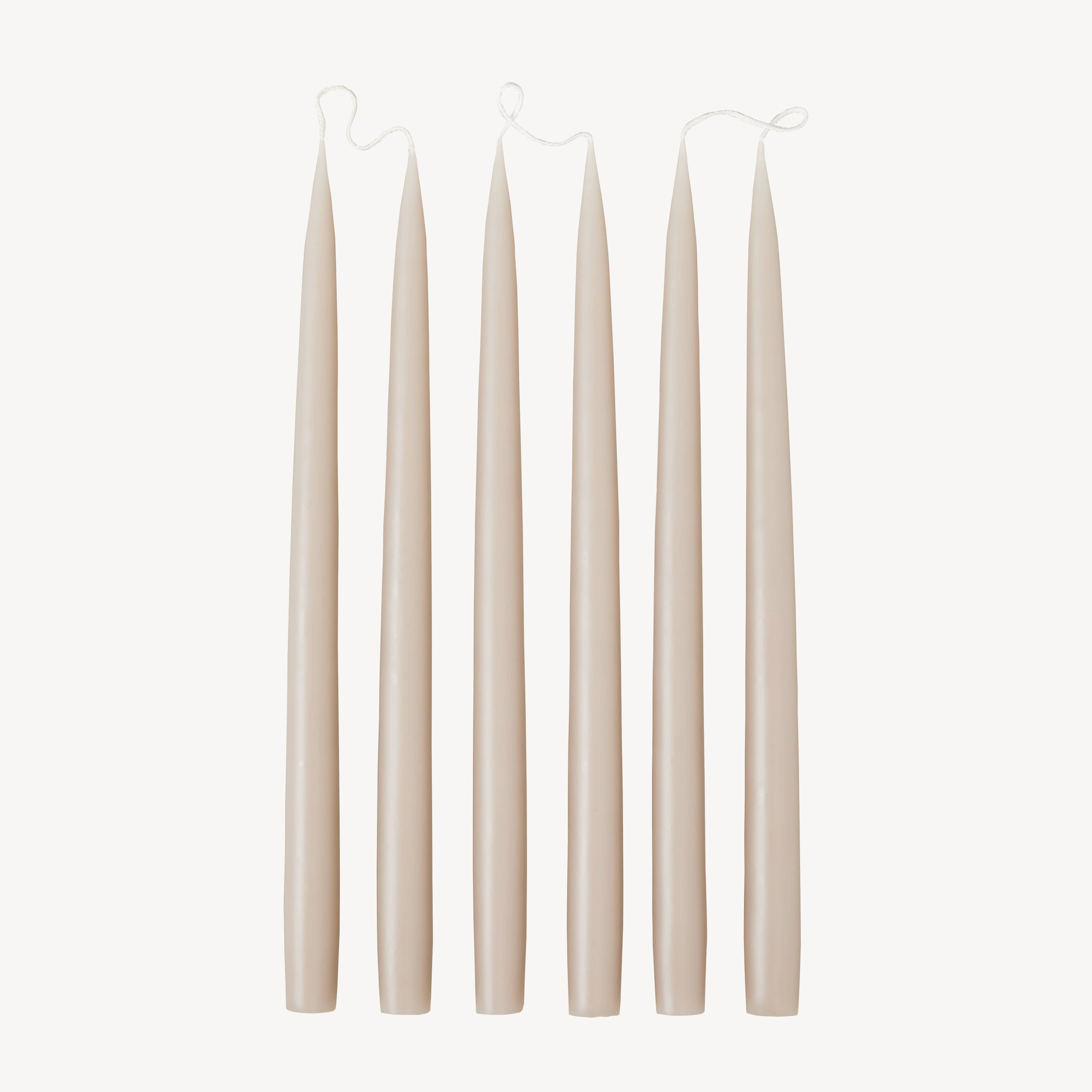 Candle Flair latte taper dinner candles, pair joined by a wick
Tall latte coloured 35cm taper candles in candlesticks on a dinner table
Candle Flair latte taper candle lit on a wooden table
Pair of cream beige dinner candles on a neutral background