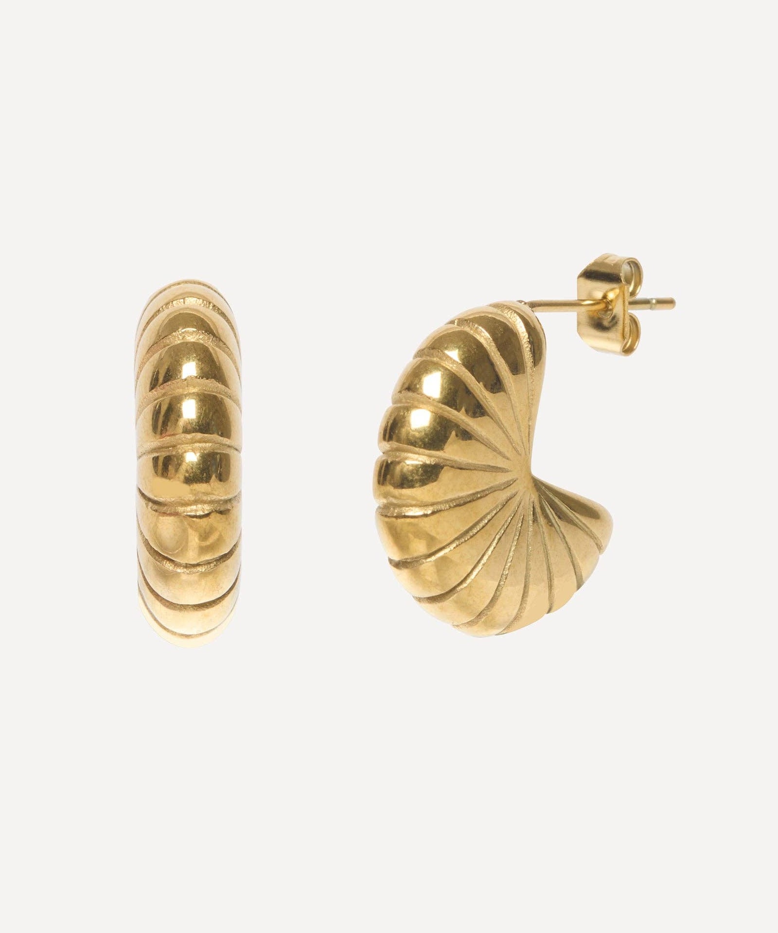 Gold hoop earrings on a white background
