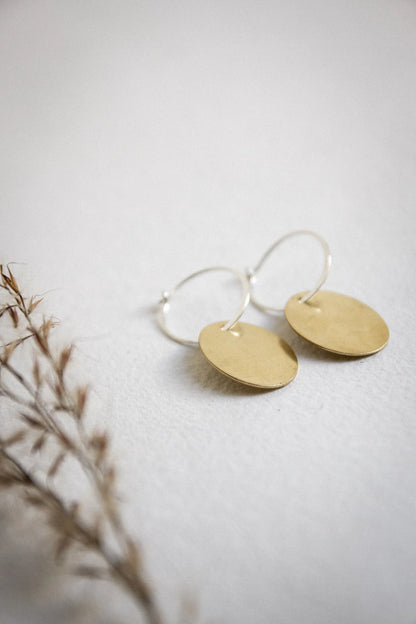 The Every Space handmade recycled brass hoop oval drop earrings with sterling silver hoops by Clare Elizabeth Kilgour