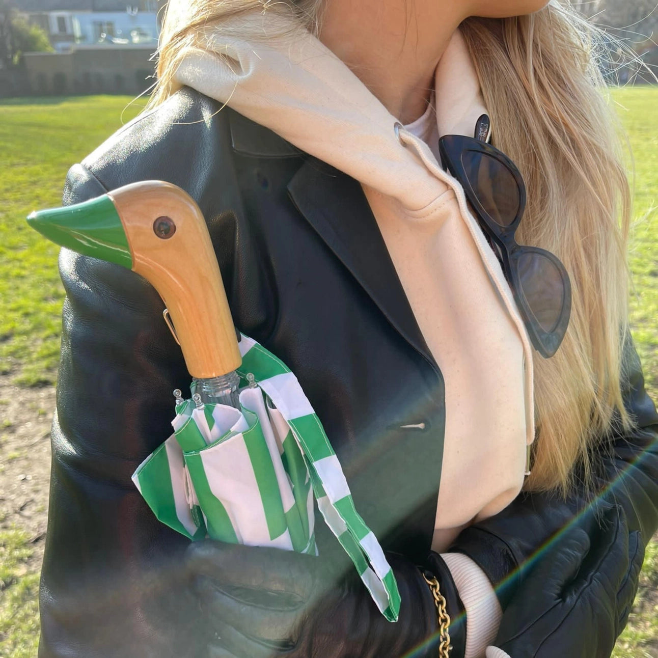 The Every Space handmade green, duck handled umbrellas, by Original Duckhead, are wind resistant with an automatic open button, and made from 100% recycled fabric.