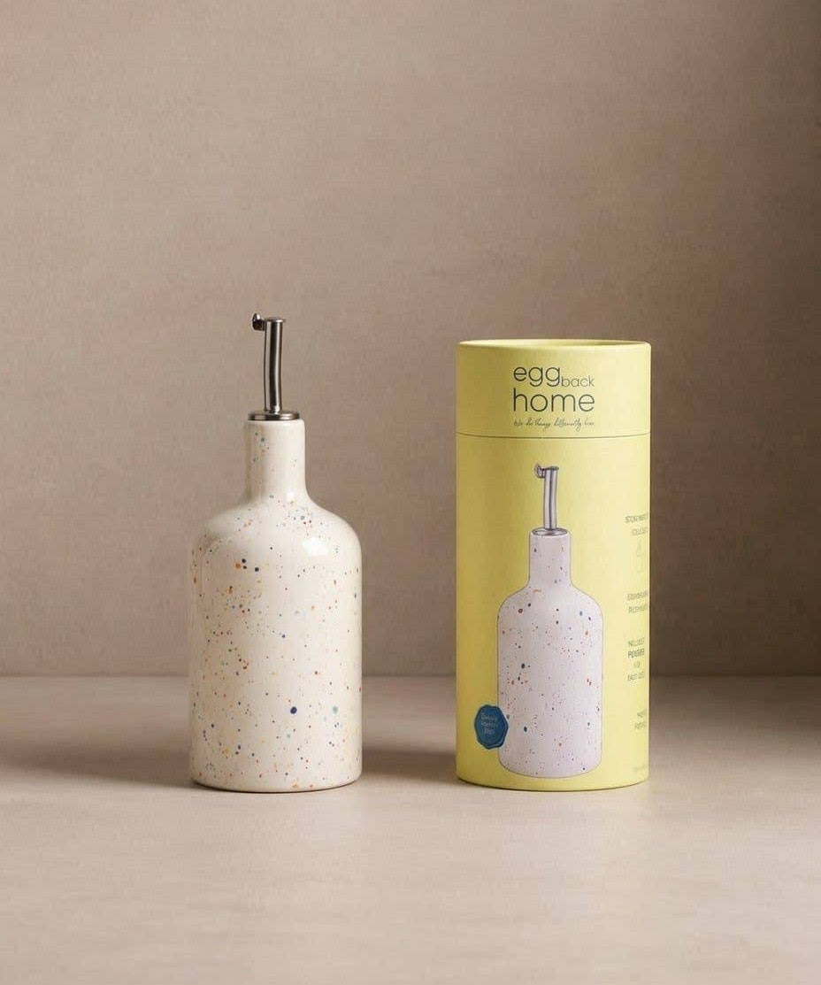 Party white speckled stoneware oil and vinegar dispenser by Egg Back Home