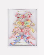 Set of floral hair bows in a branded box on a white background