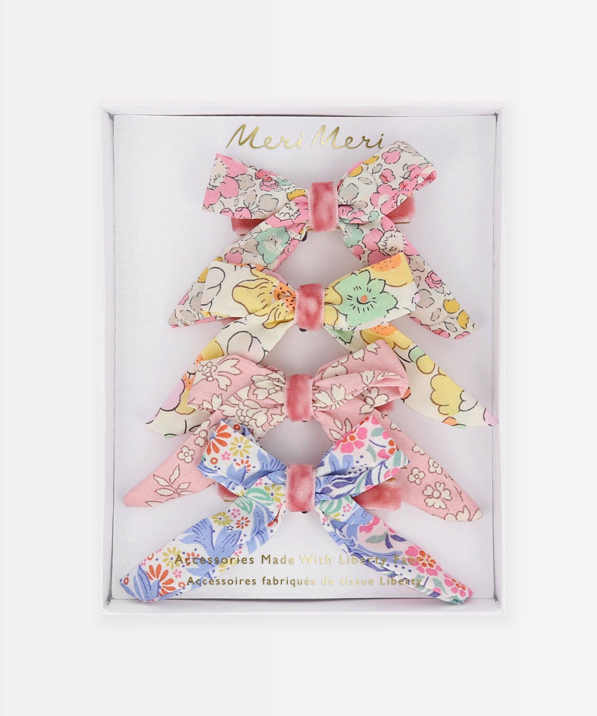 Set of floral hair bows in a branded box on a white background