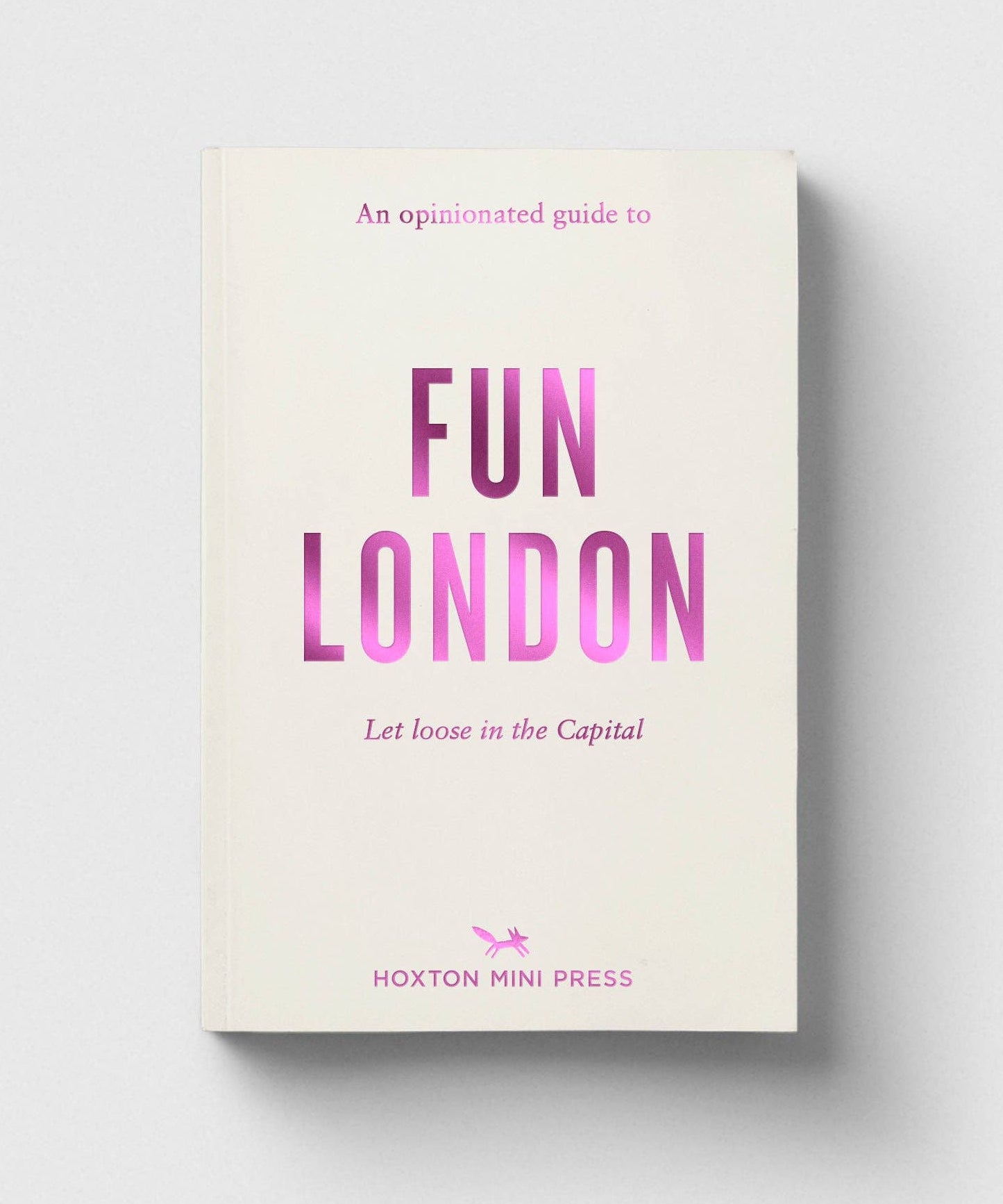 Book titled 'An Opinionated Guide to Fun London' by Hoxton Mini Press on a light gray background