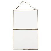 Hanging rectangular mirror with gold frame on a white background
