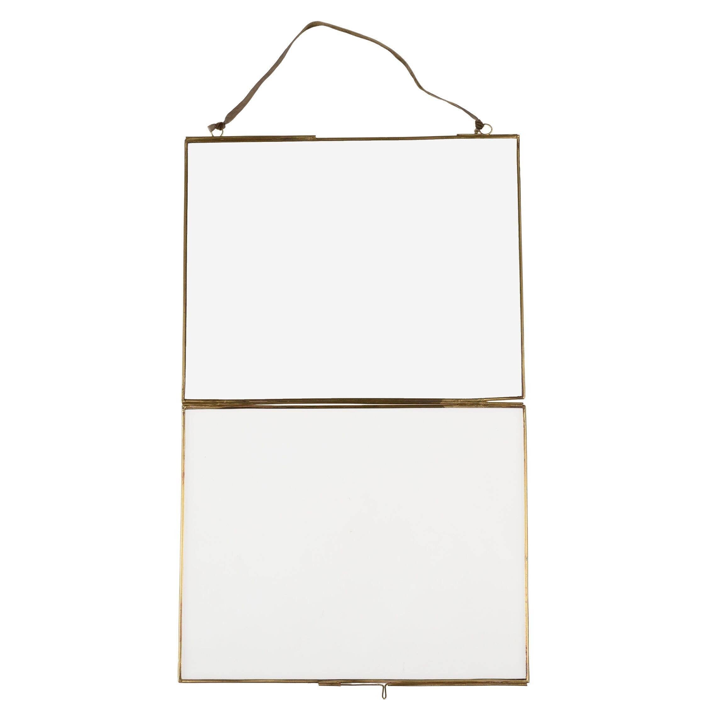 Hanging rectangular mirror with gold frame on a white background