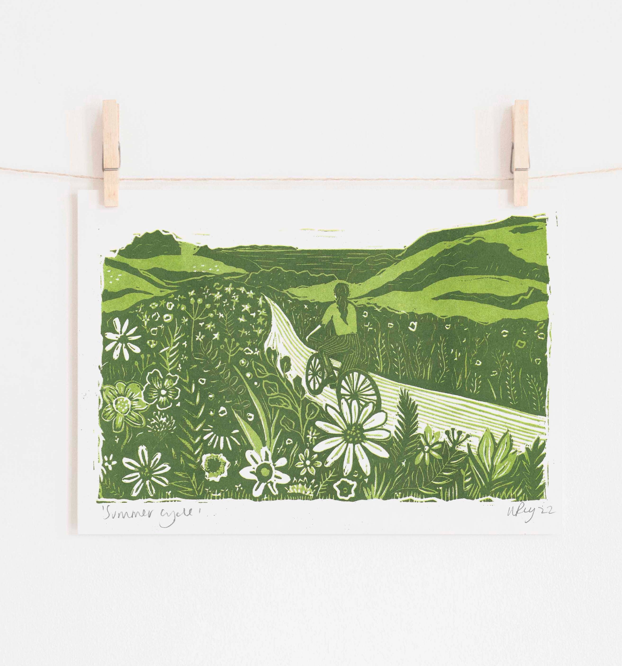 Riso print of a cyclist riding through a summer countryside hedgerow