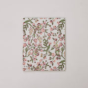 The back of a floral patterned picture frame made from recycled cotton paper, on a white background