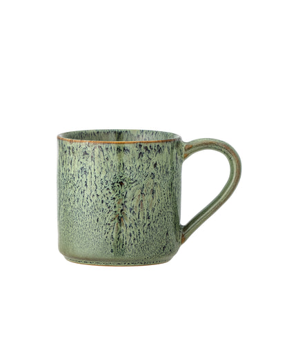 The Every Space hand-decorated Feras Cup in a raw reactive green glaze by Bloomingville