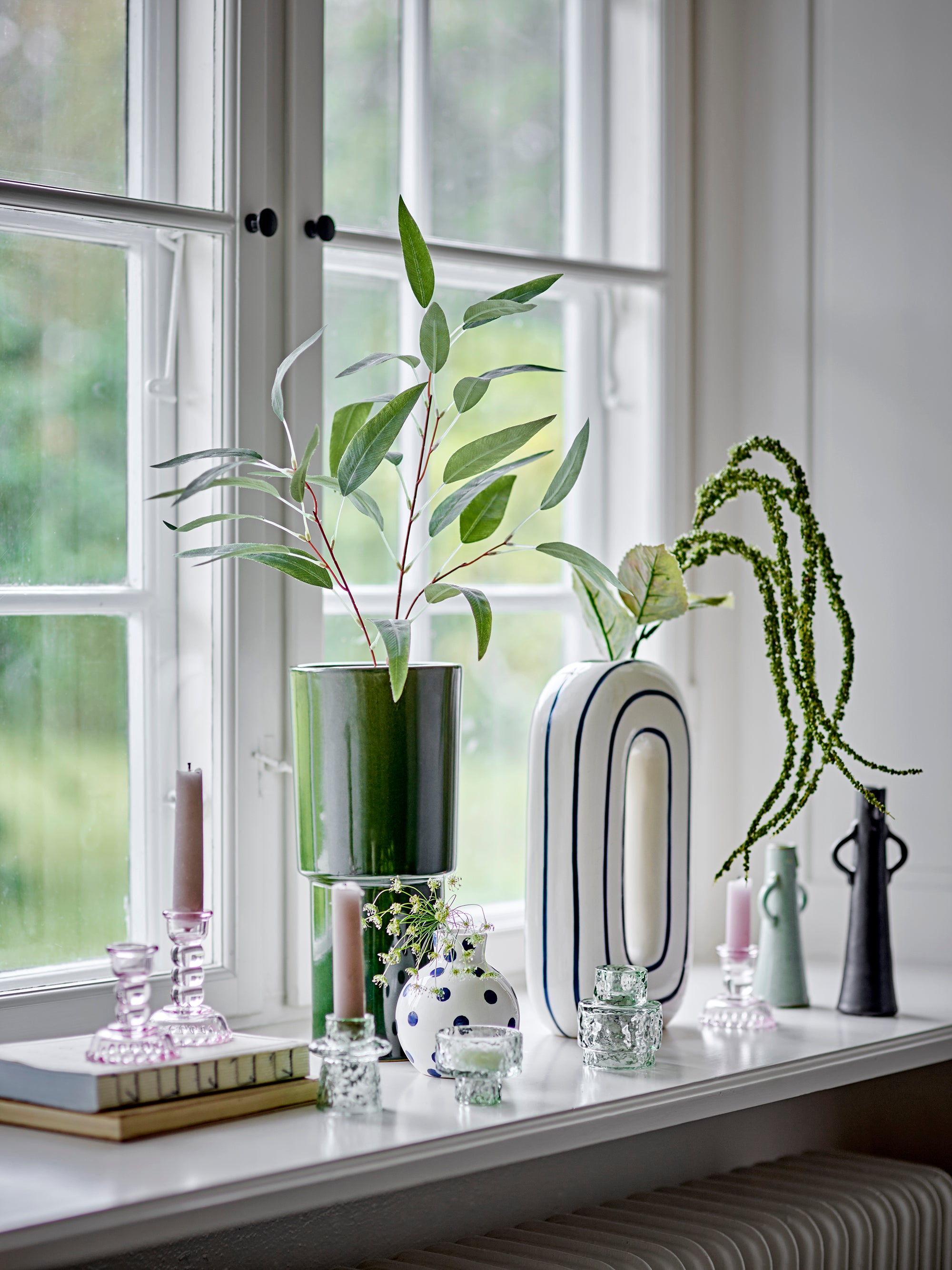 Fian vase on a window seal with other bloomingville vases